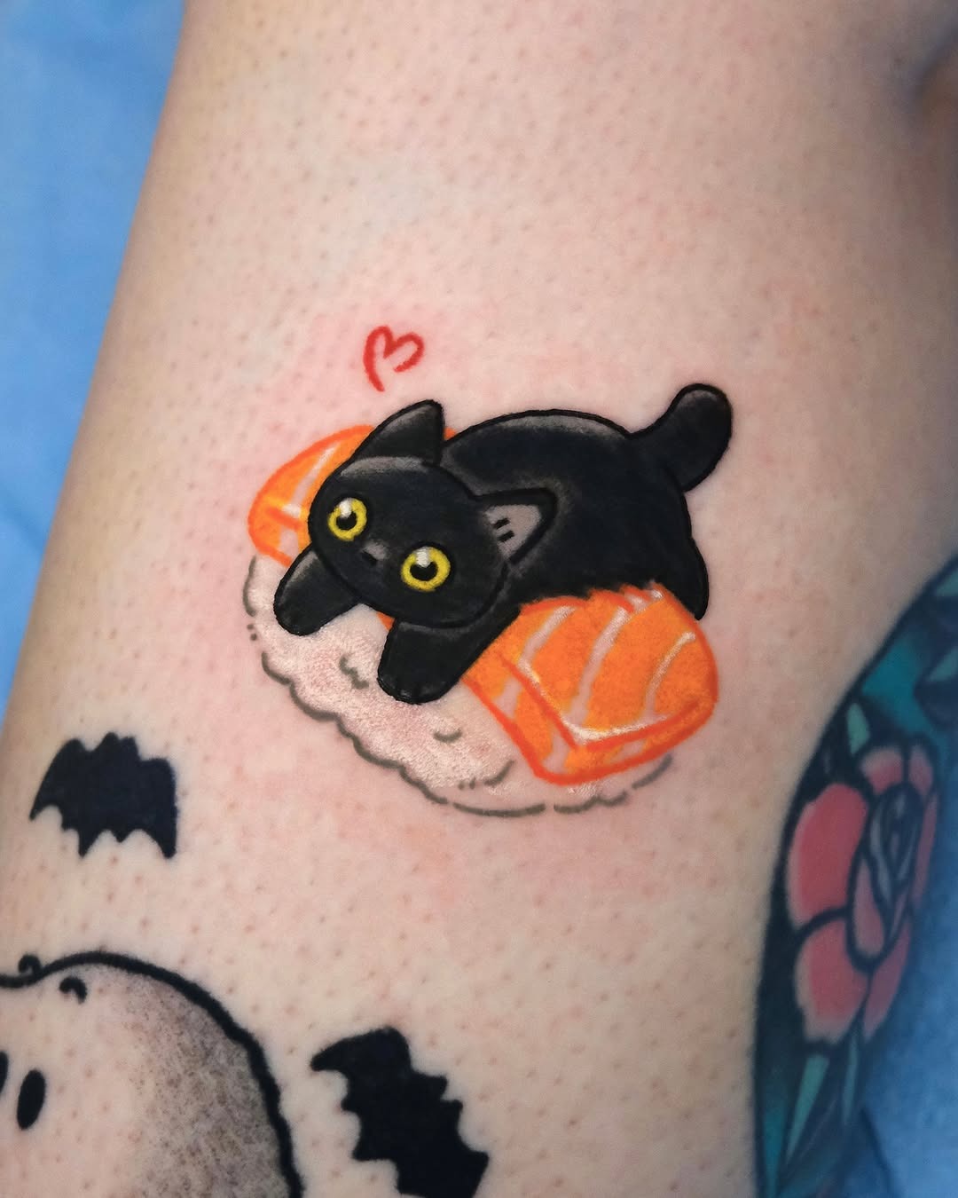 Adorable kitty lounging on sushi slice tattoo Tattoo Design