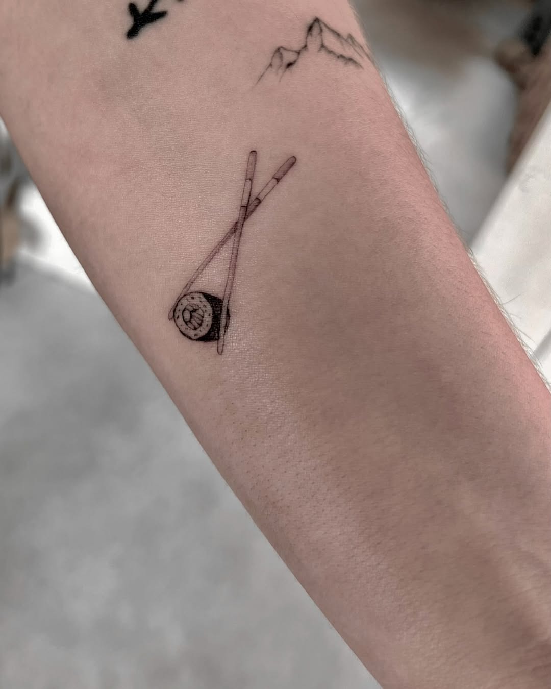 Charming sushi roll with chopsticks tattoo Tattoo Design
