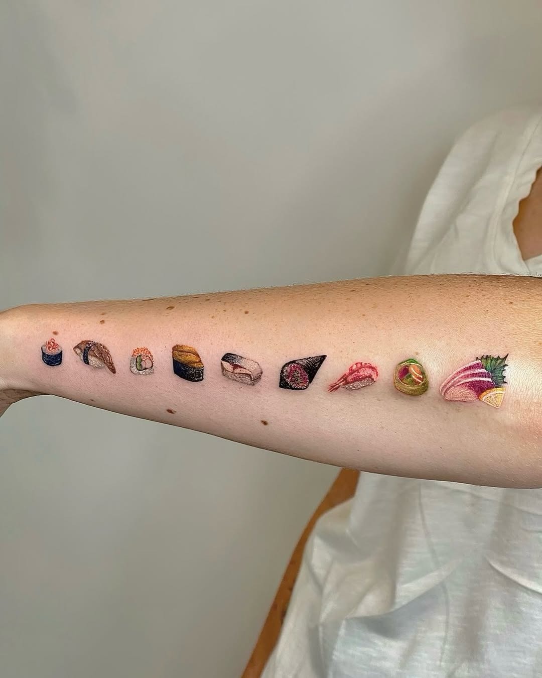 Colorful sushi tattoo collection on arm Tattoo Design