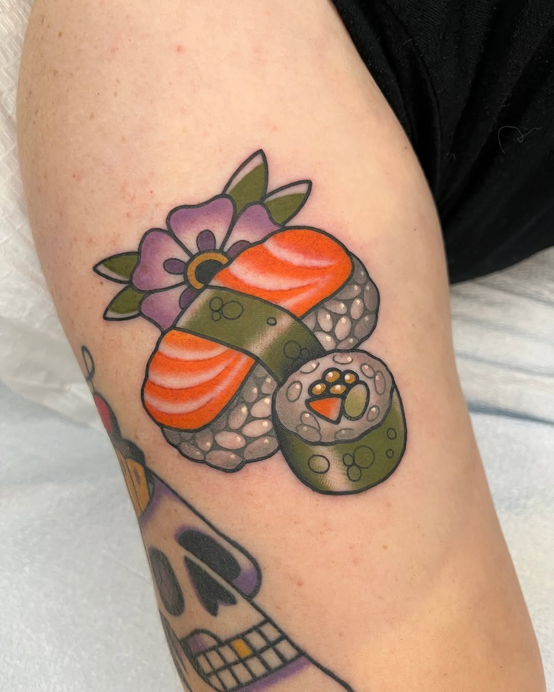 Vibrant Sushi Roll Tattoo with Floral Accents Tattoo Design