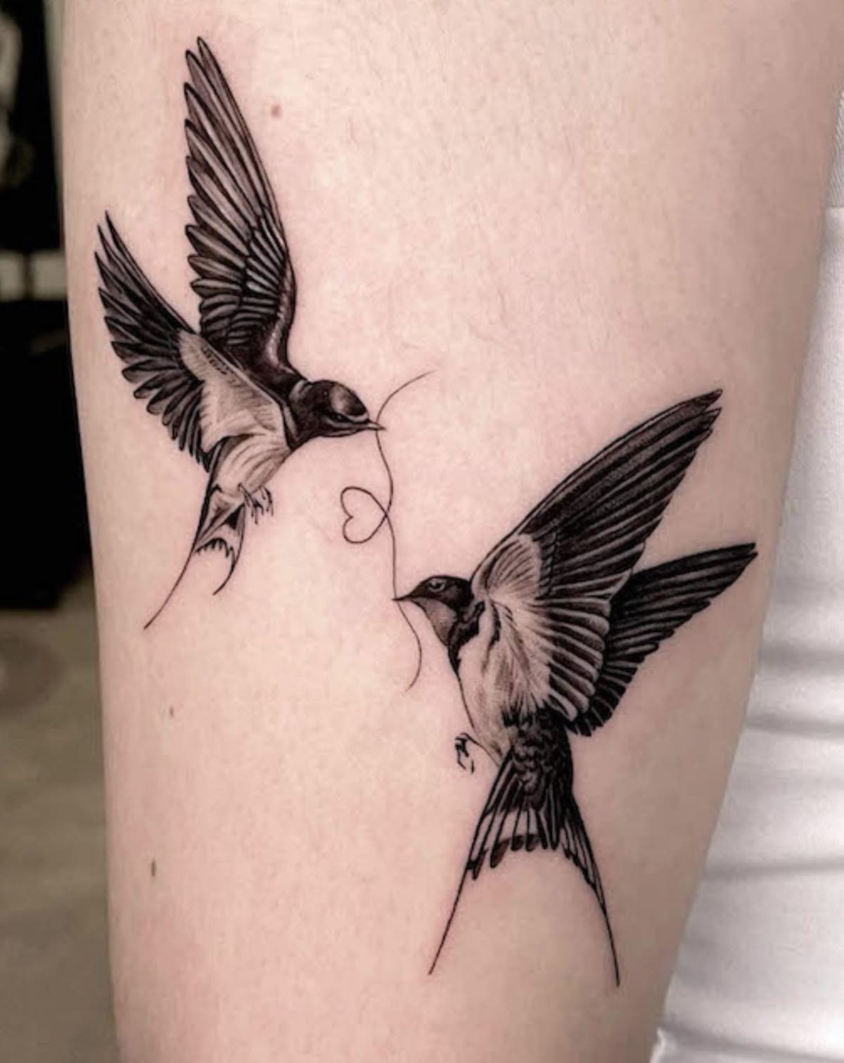 Swallow Pair Connected by a Tiny Heart Tattoo Design