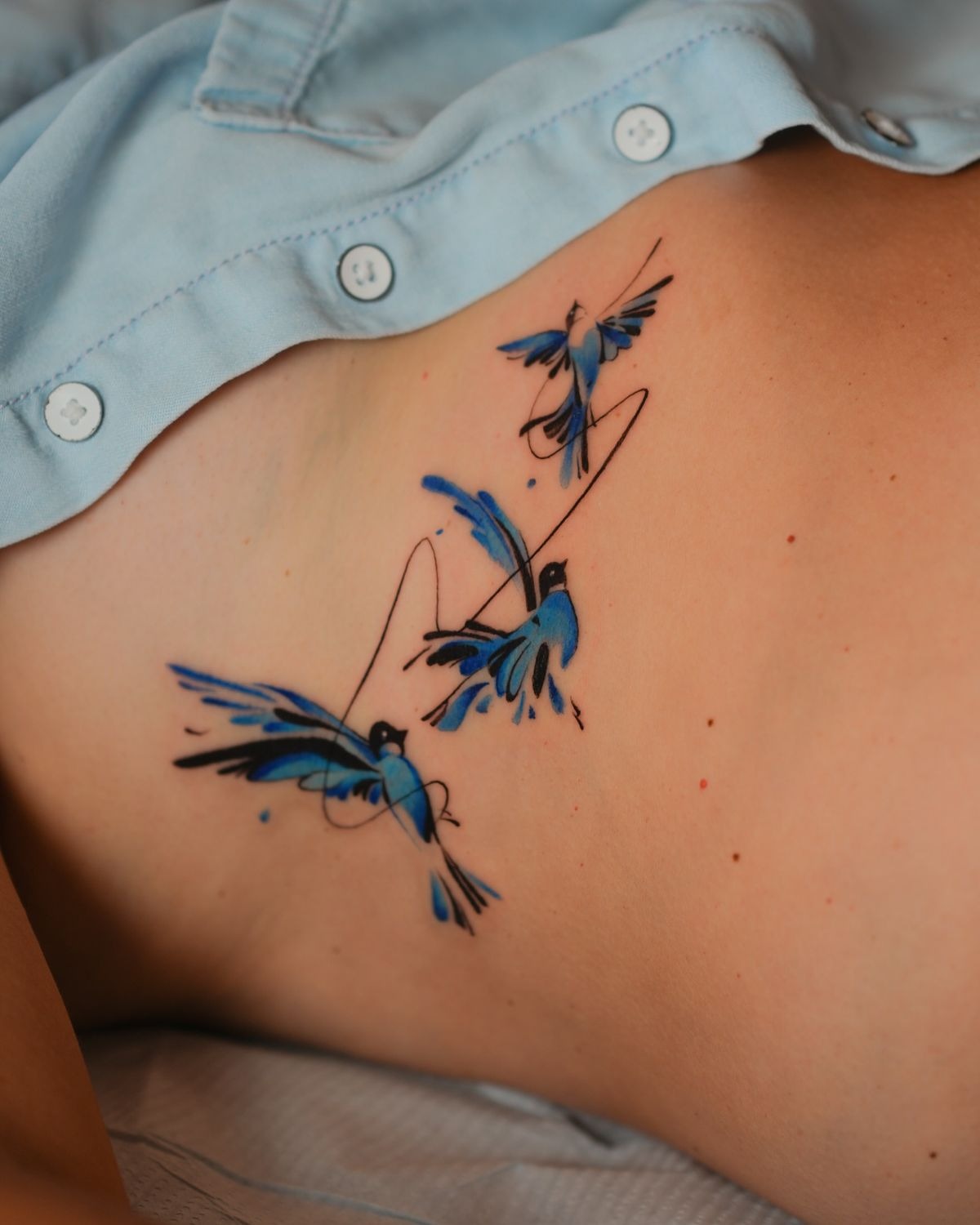 Three Abstract Blue Swallows Tattoo Design