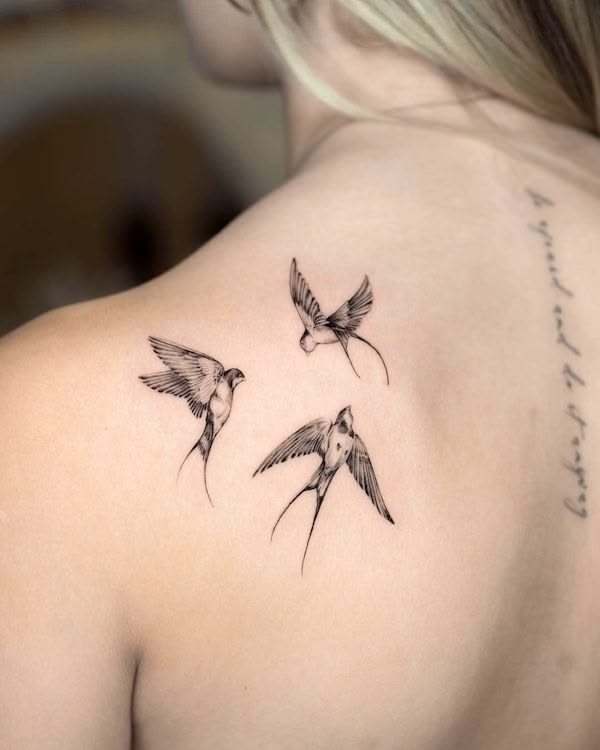 Three Delicate Swallows on the Shoulder Blade Tattoo Design