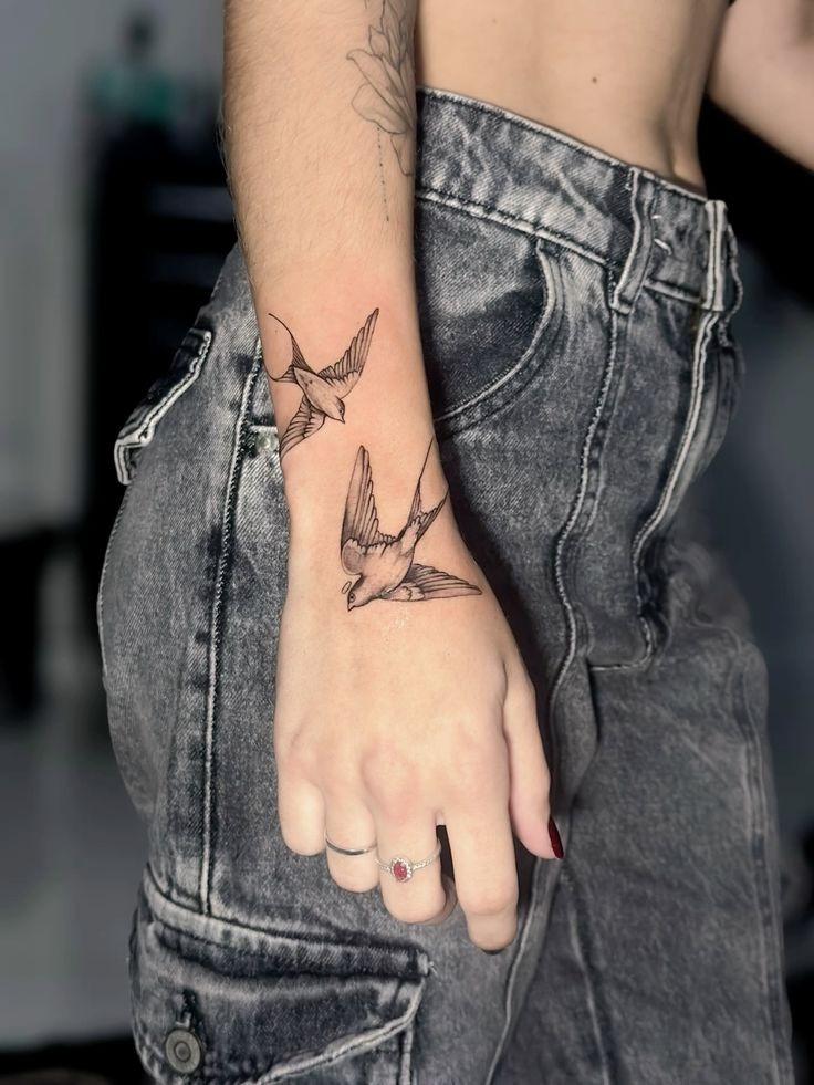 Two Fine Line Swallows on the Wrist and Forearm Tattoo Design