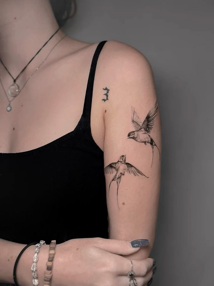 Two Realistic Swallows on the Upper Arm Tattoo Design