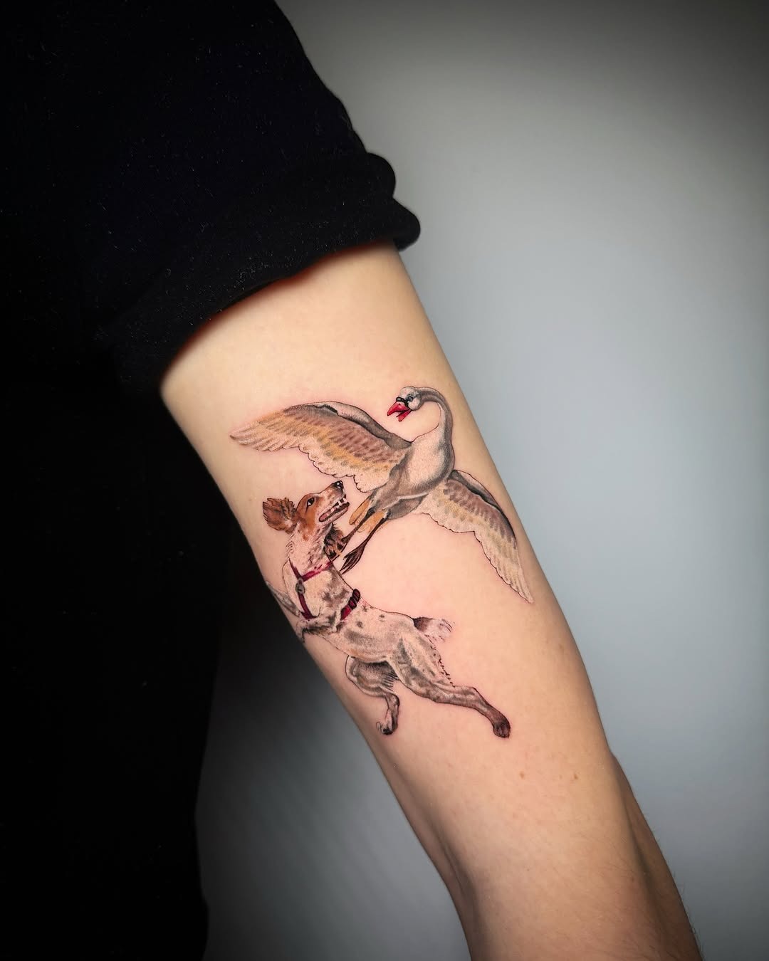 Dynamic Tattoo of Dog Chasing a Swan Tattoo Design