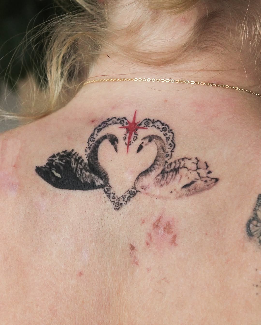 Elegant swan design with a heart motif. Tattoo Design