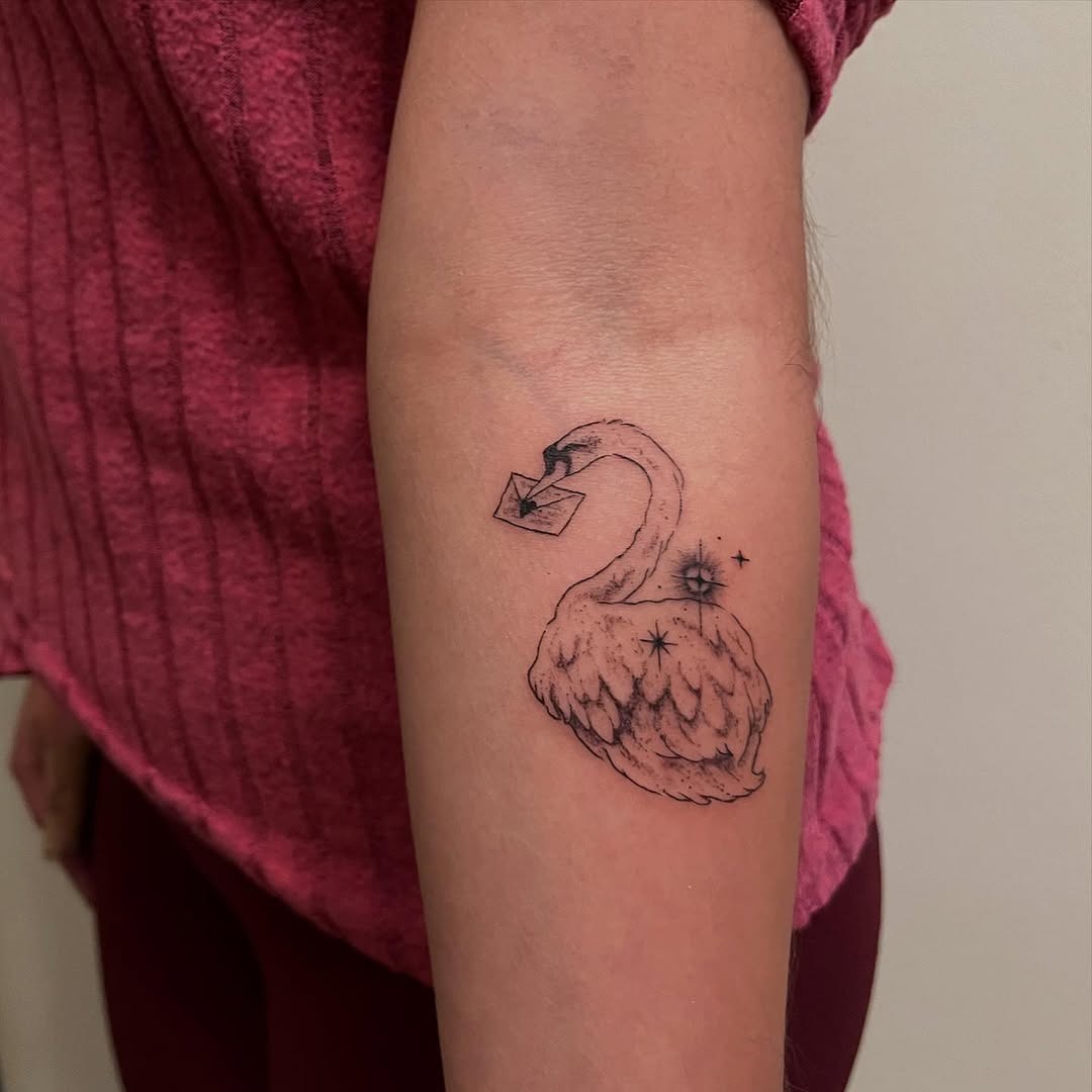 Elegant swan tattoo holding an envelope Tattoo Design