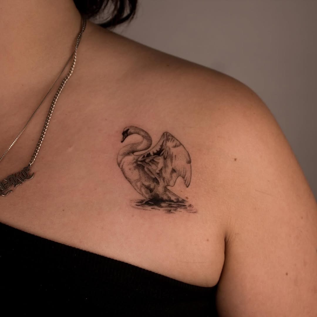 Elegant swan tattoo on shoulder area Tattoo Design