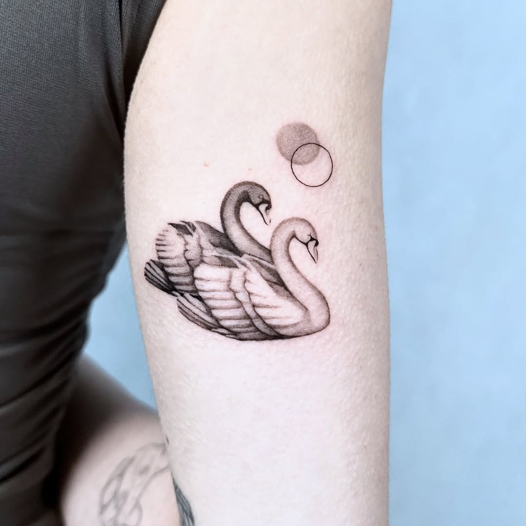 Elegant swan tattoo showcasing love and harmony. Tattoo Design