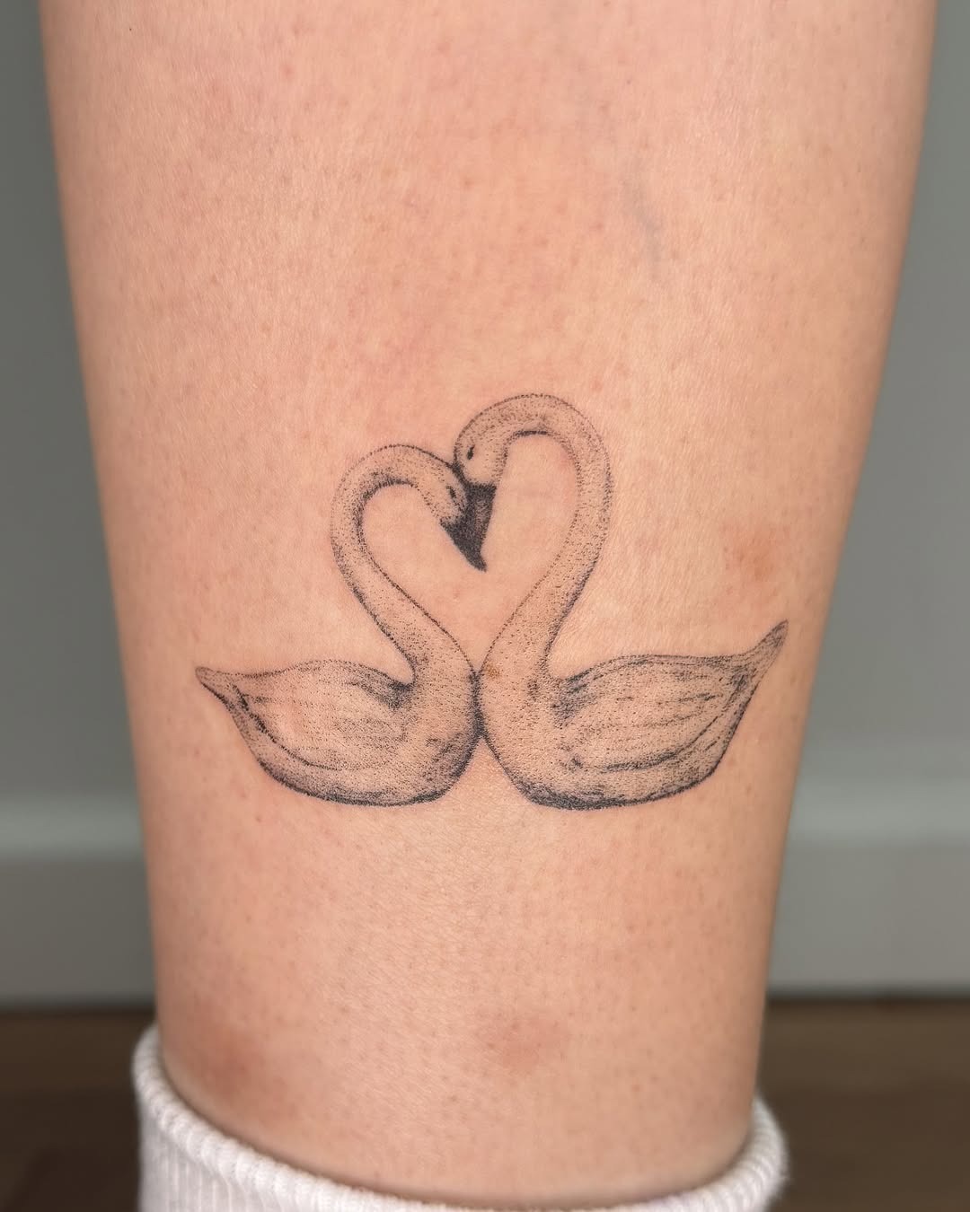 Elegant swan tattoo symbolizing love and unity Tattoo Design