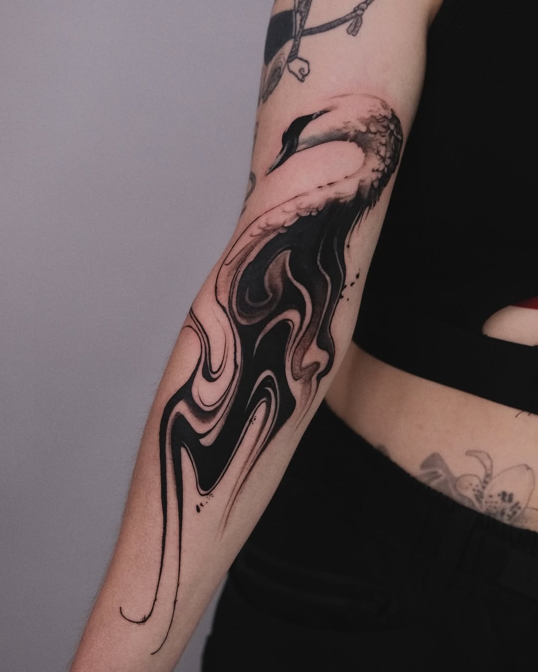 Elegant swan tattoo with abstract design elements Tattoo Design