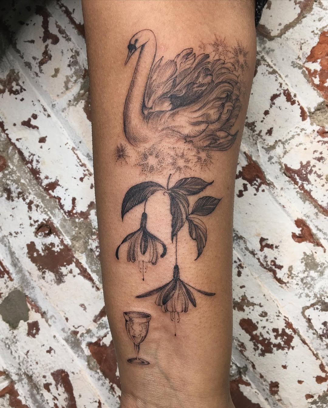 Elegant swan tattoo with floral accents Tattoo Design