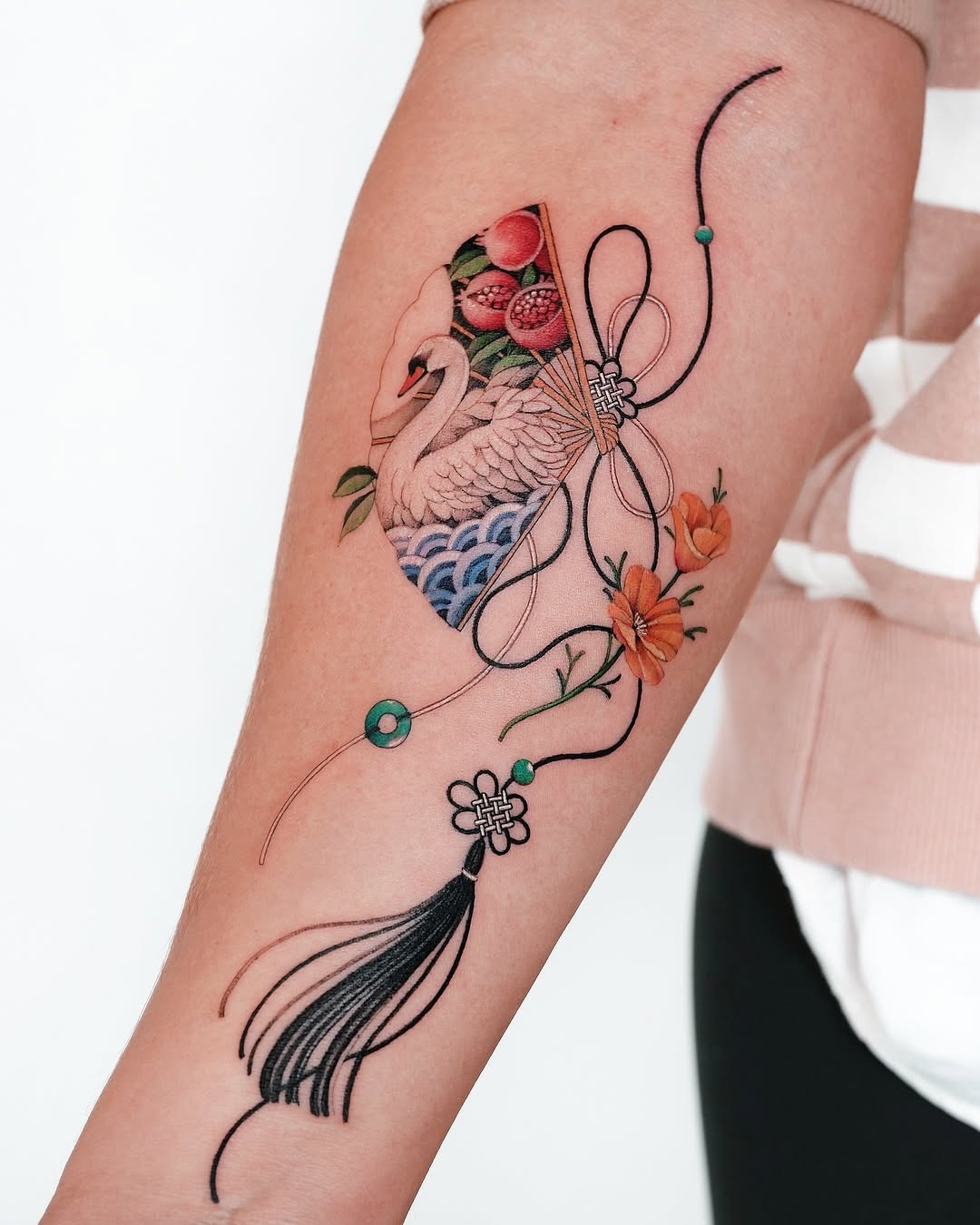 Elegant swan tattoo with floral elements Tattoo Design