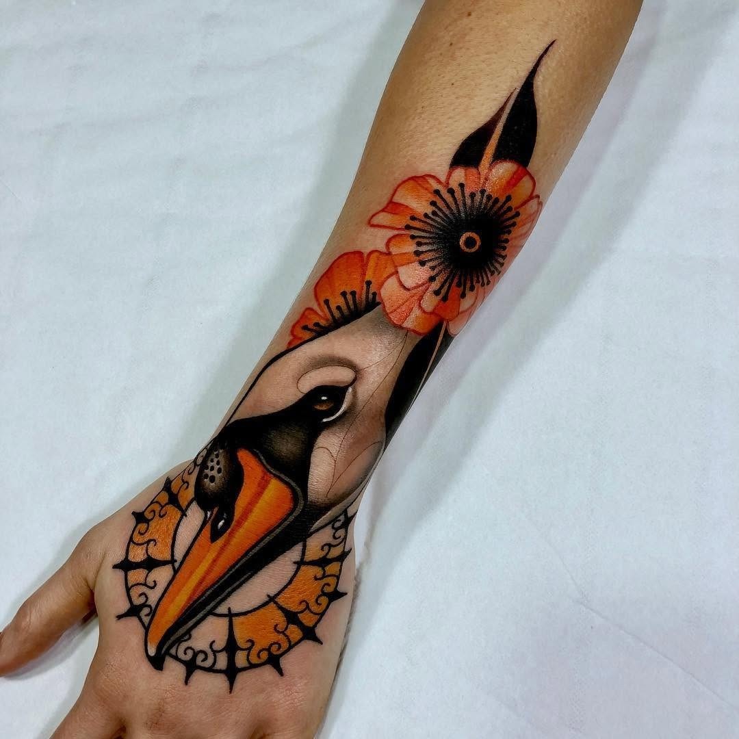 Elegant Swan Tattoo with Floral Elements Tattoo Design