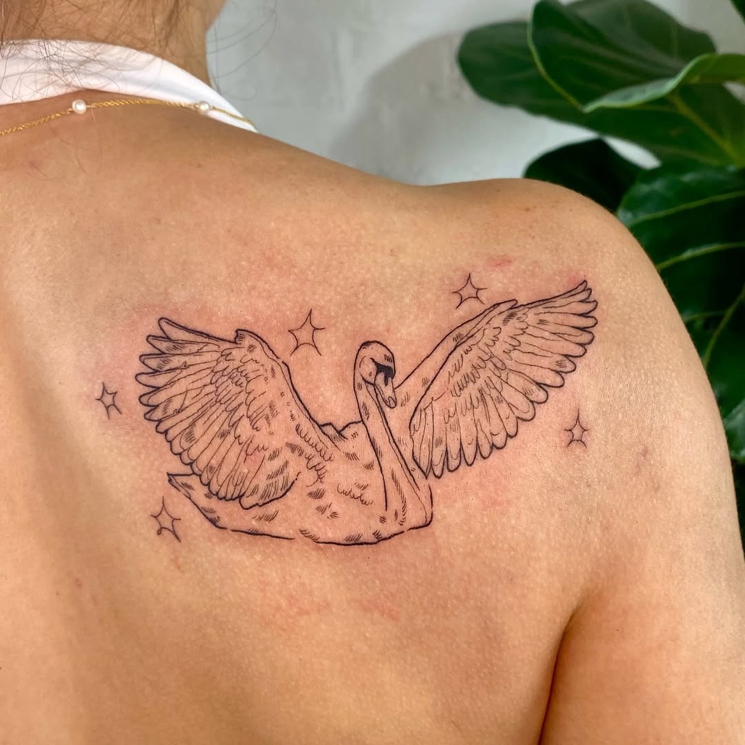 Elegant swan tattoo with graceful wings and stars Tattoo Design