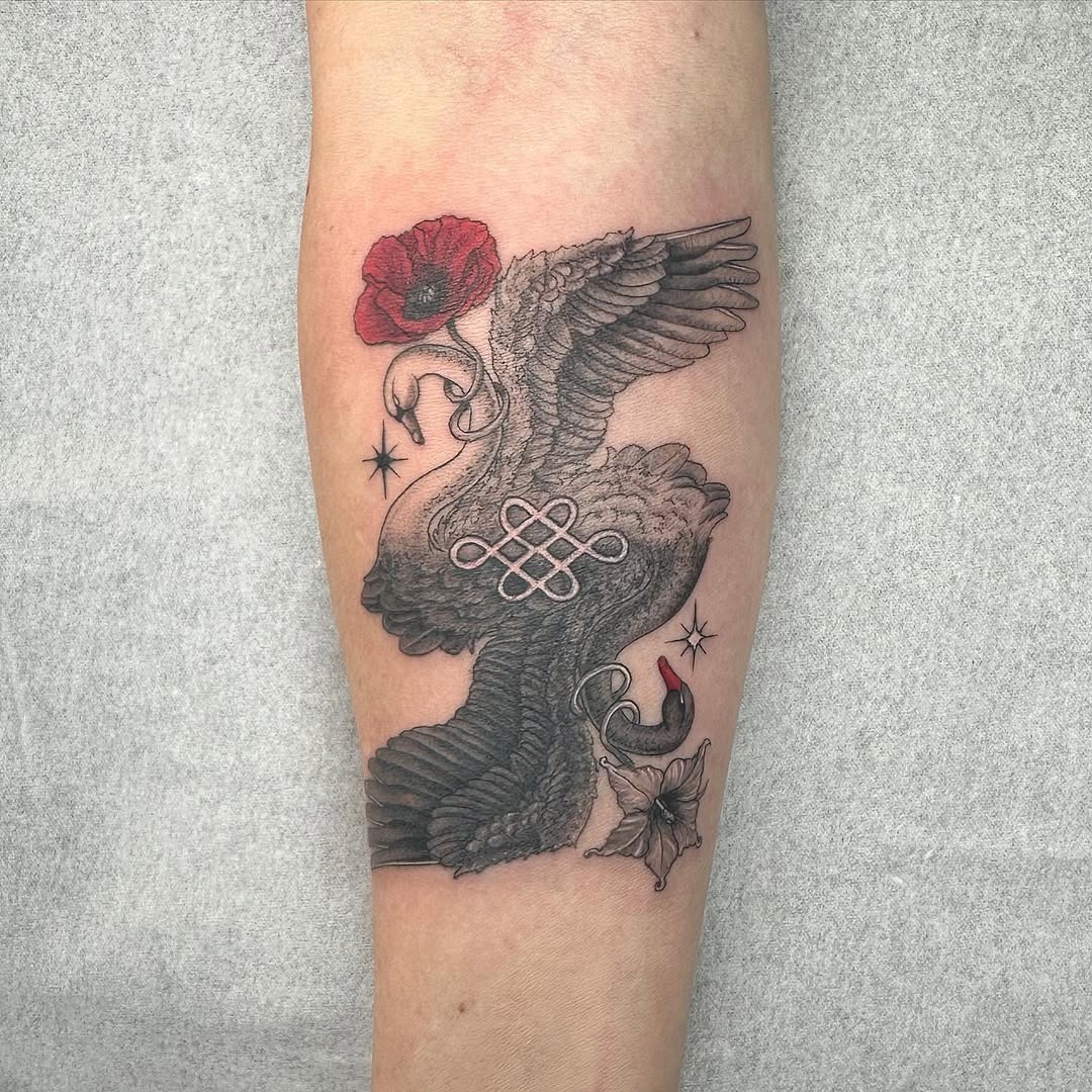 Elegant swan tattoo with poppy flower accent Tattoo Design