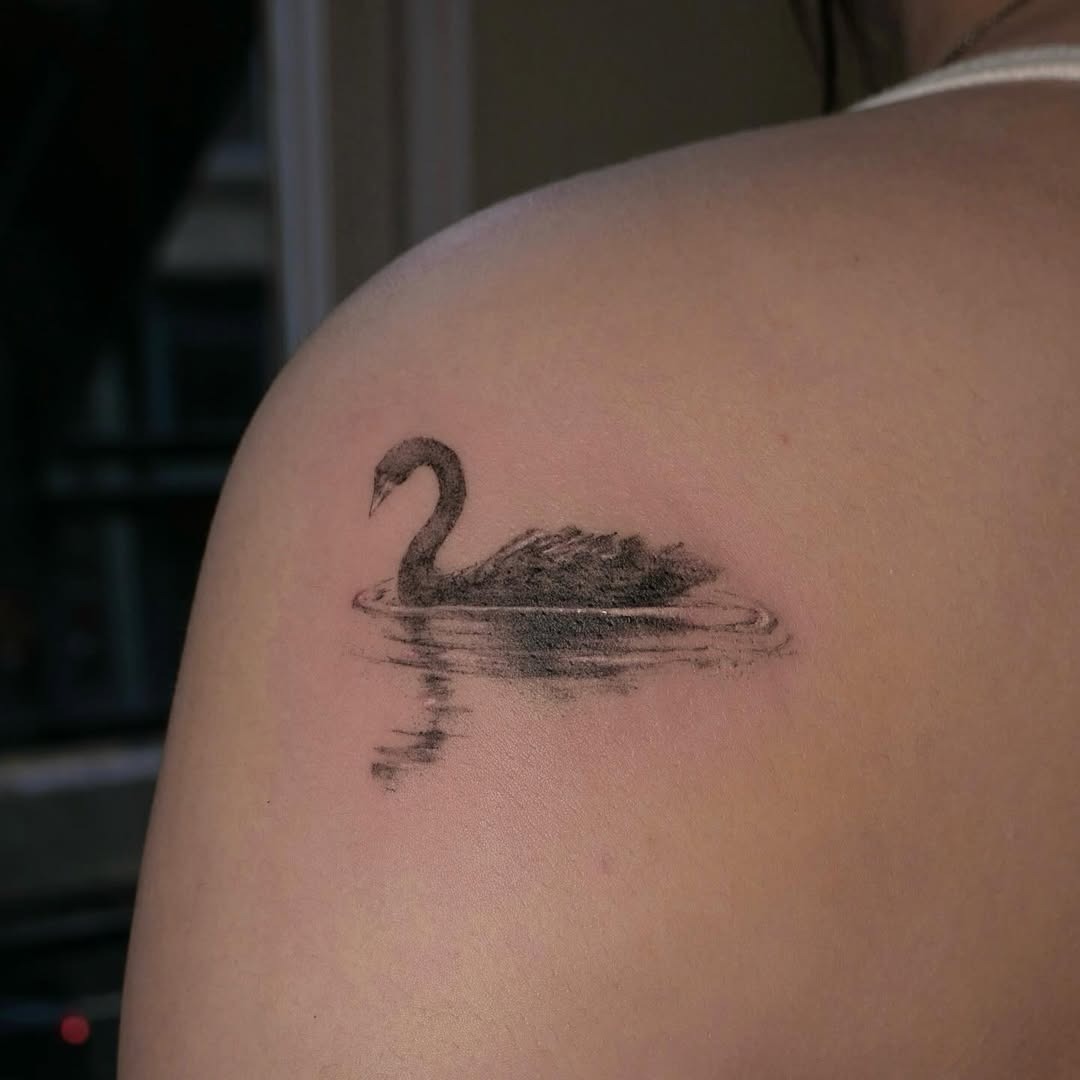Elegant swan tattoo with serene water reflections Tattoo Design
