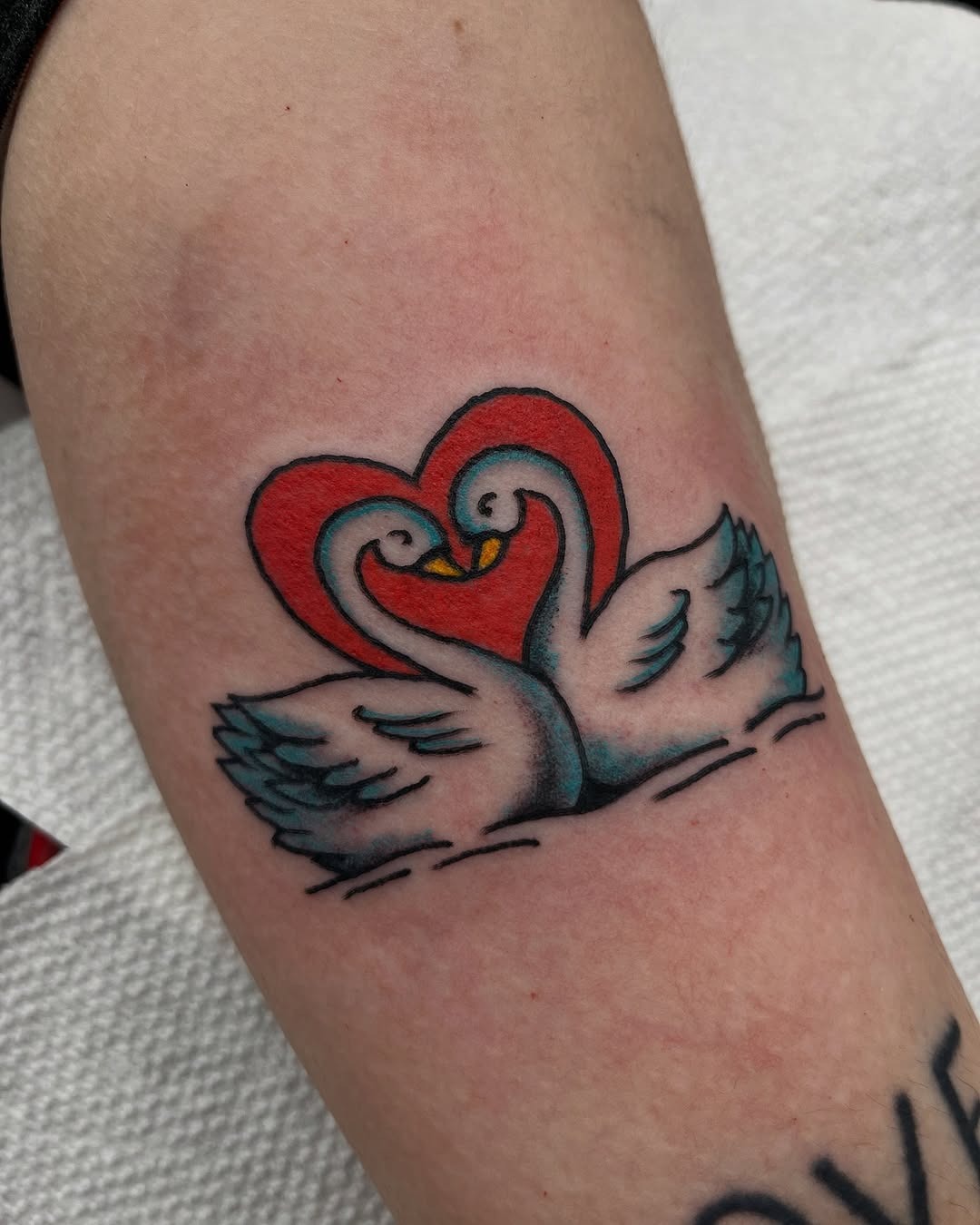 Elegant swans forming a heart shape tattoo Tattoo Design