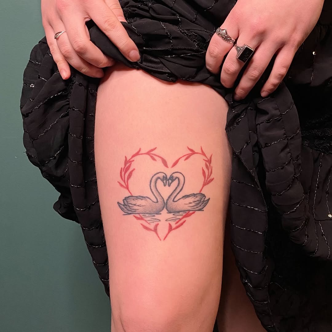 Elegant swans intertwined in a heart shape Tattoo Design