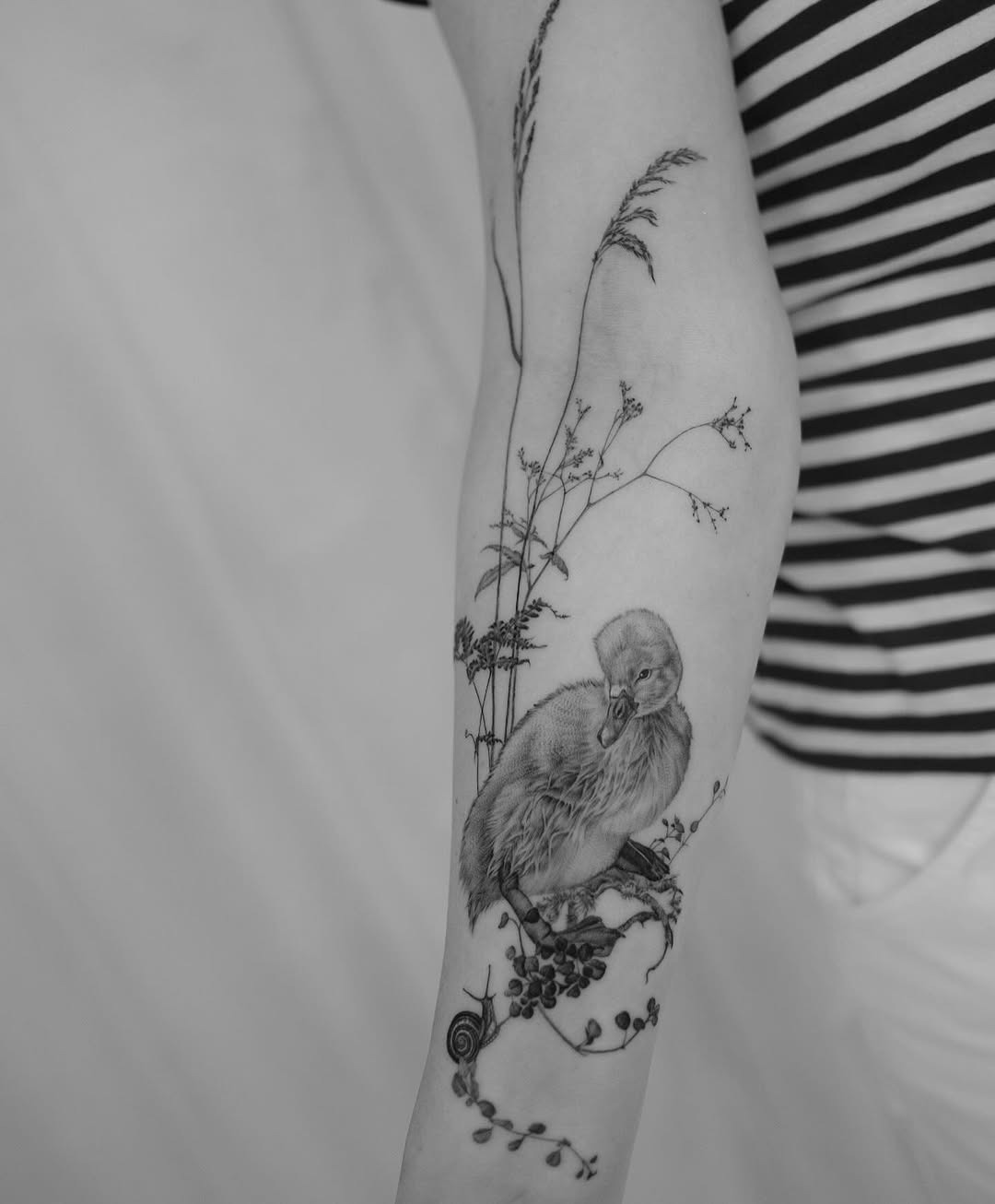 Intricate swan tattoo with nature elements Tattoo Design