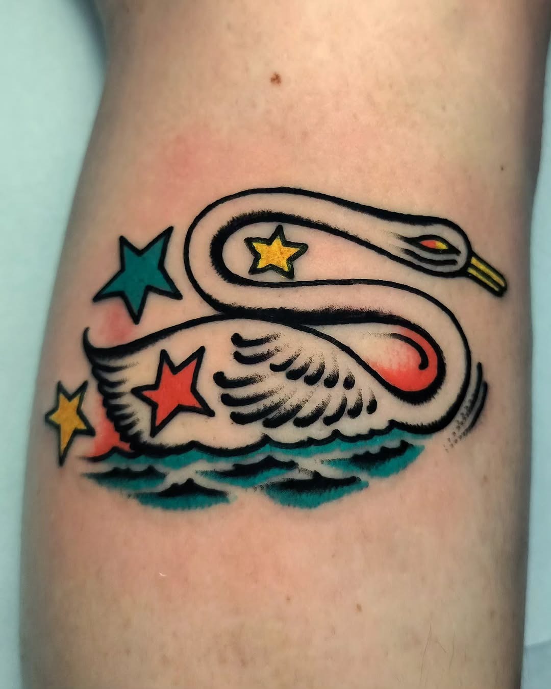 Whimsical swan tattoo with vibrant colors Tattoo Design
