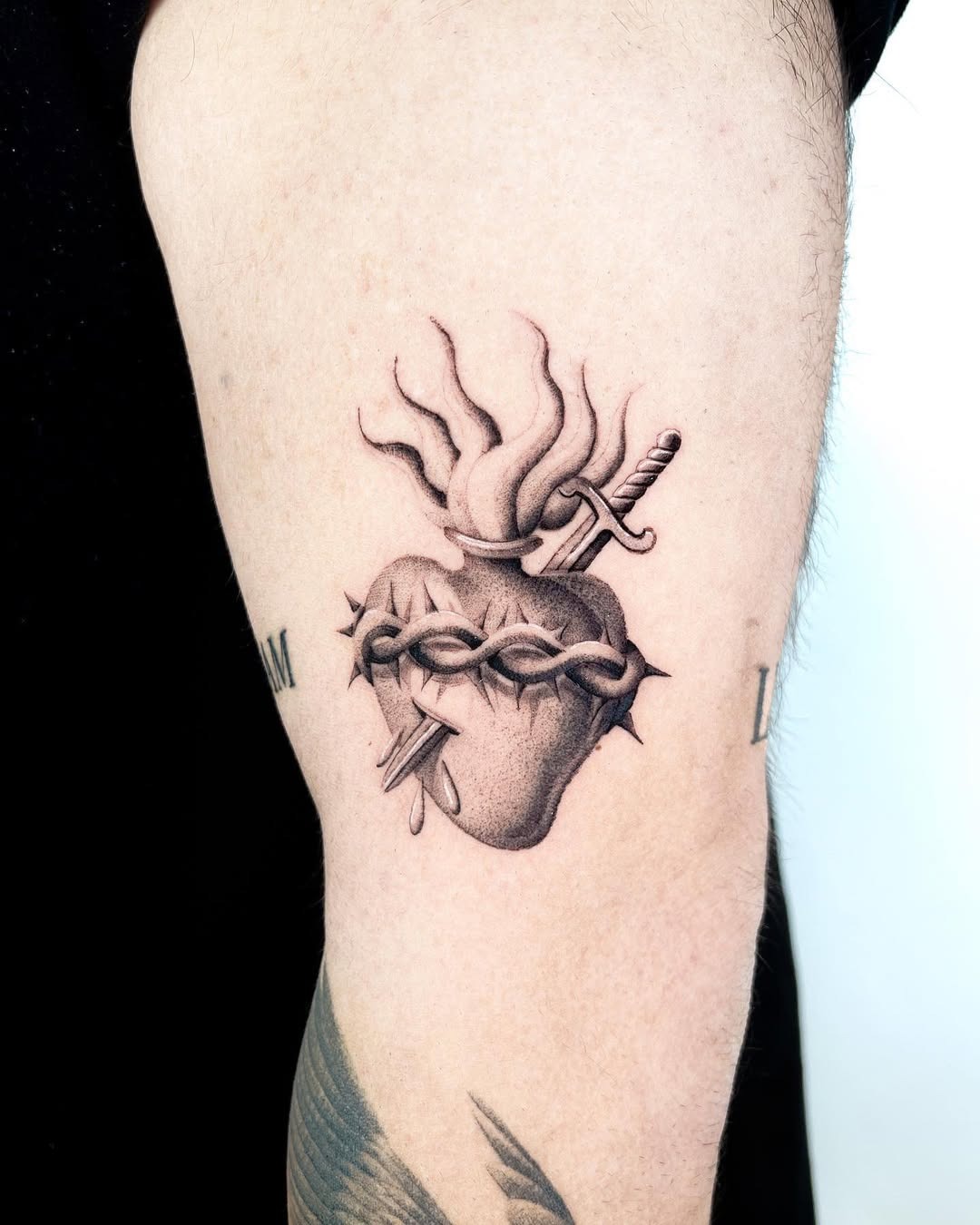 Artistic sword tattoo entwined with a heart Tattoo Design