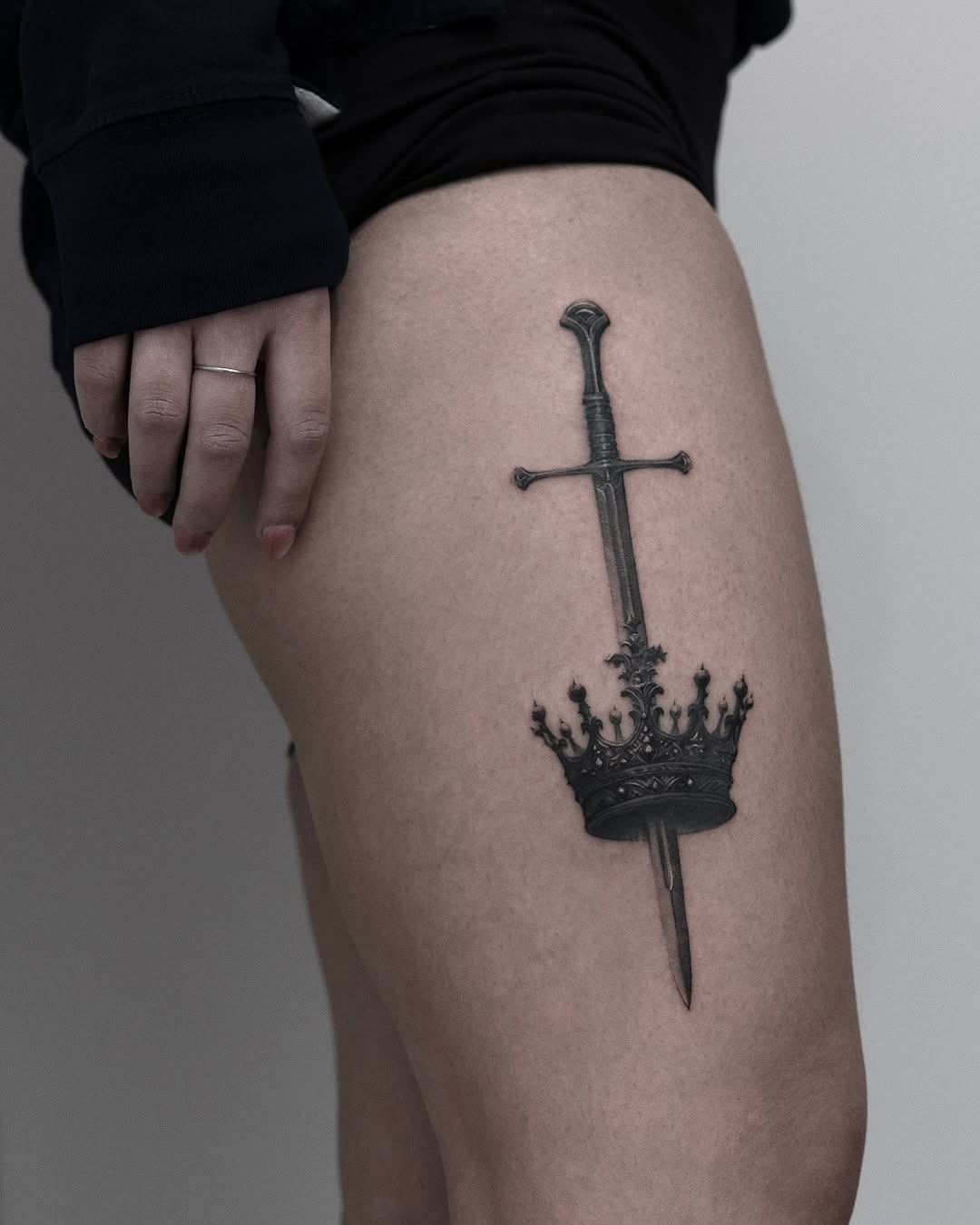 Bold sword and crown tattoo design Tattoo Design