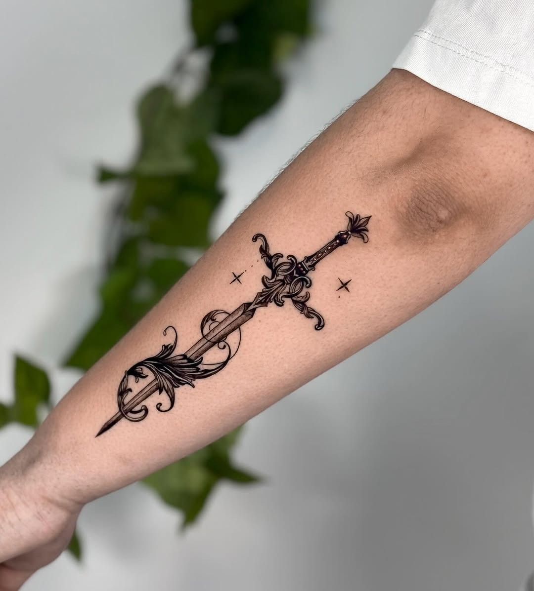 Elegant sword tattoo with detailed design Tattoo Design