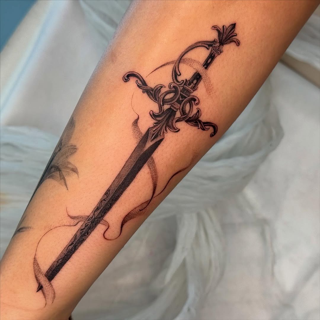 Elegant sword tattoo with intricate details. Tattoo Design