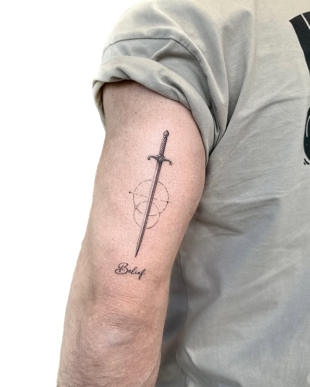 Geometric Sword Tattoo with Meaningful Text Tattoo Design