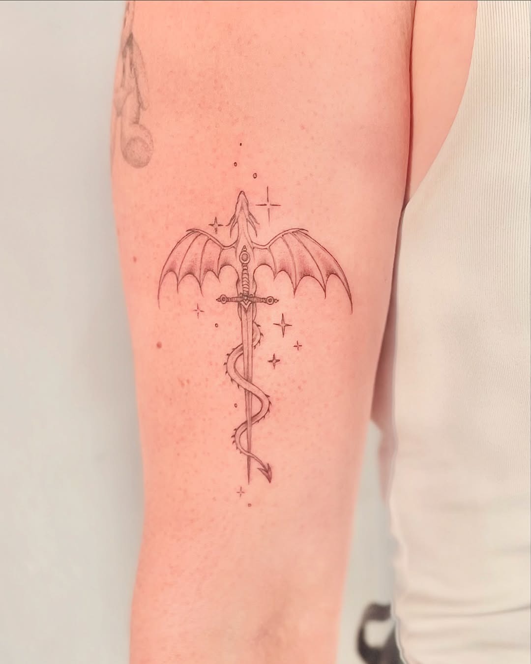 Intricate sword tattoo with bat wings design Tattoo Design