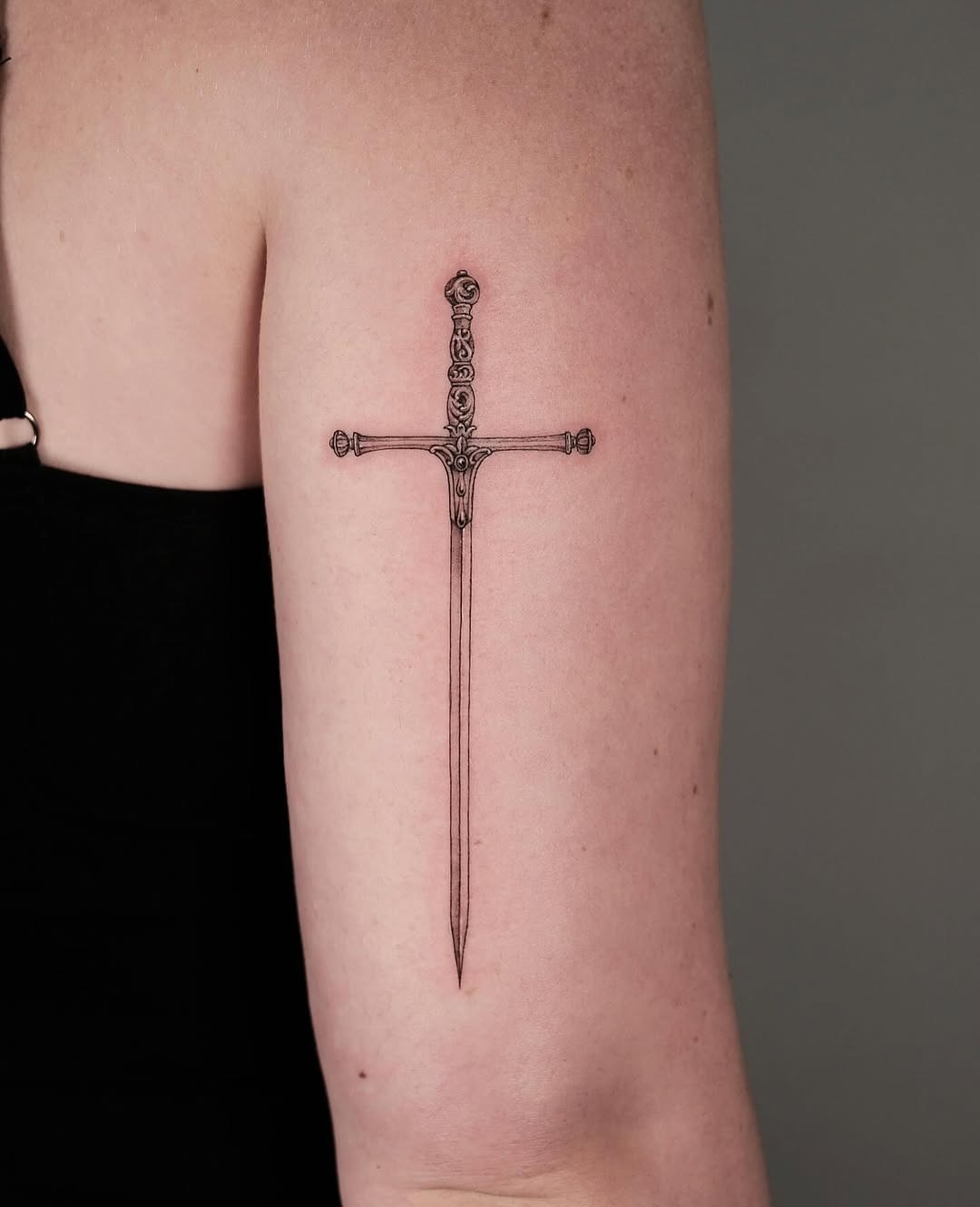 Stunning Fine Line Sword Tattoo on Arm Tattoo Design