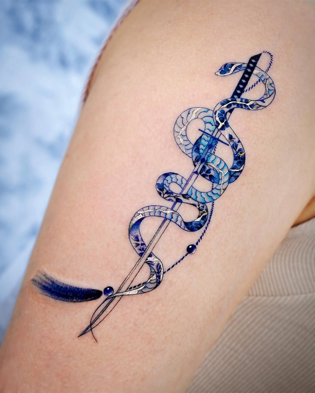 Unique blue snake entwined sword tattoo Tattoo Design