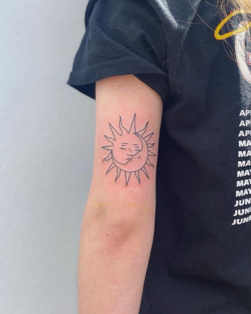 Holding Sun and Moon Hand Tattoo Tattoo Design