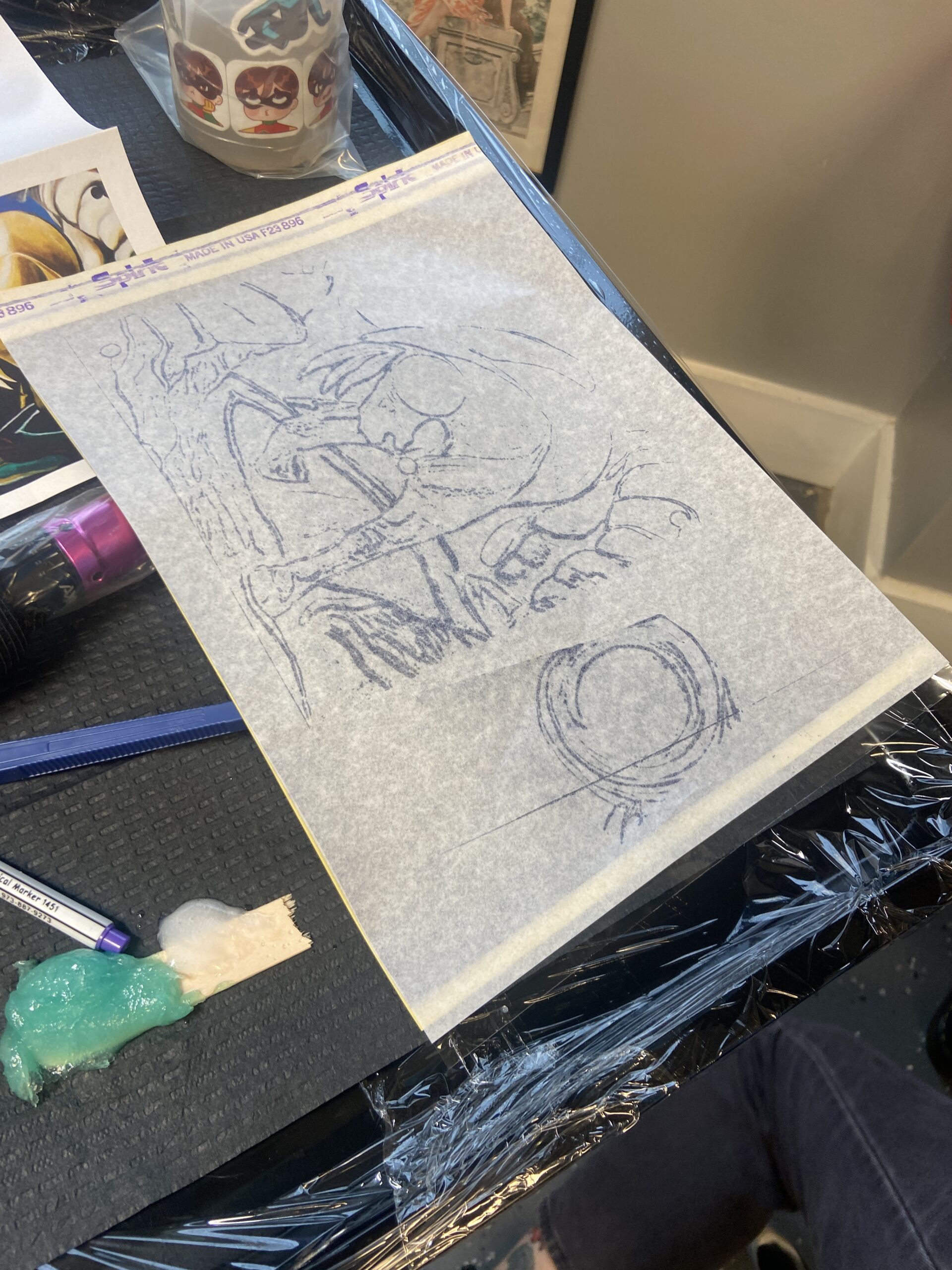 Tattoo artwork transferred onto stencil paper during design preparation.