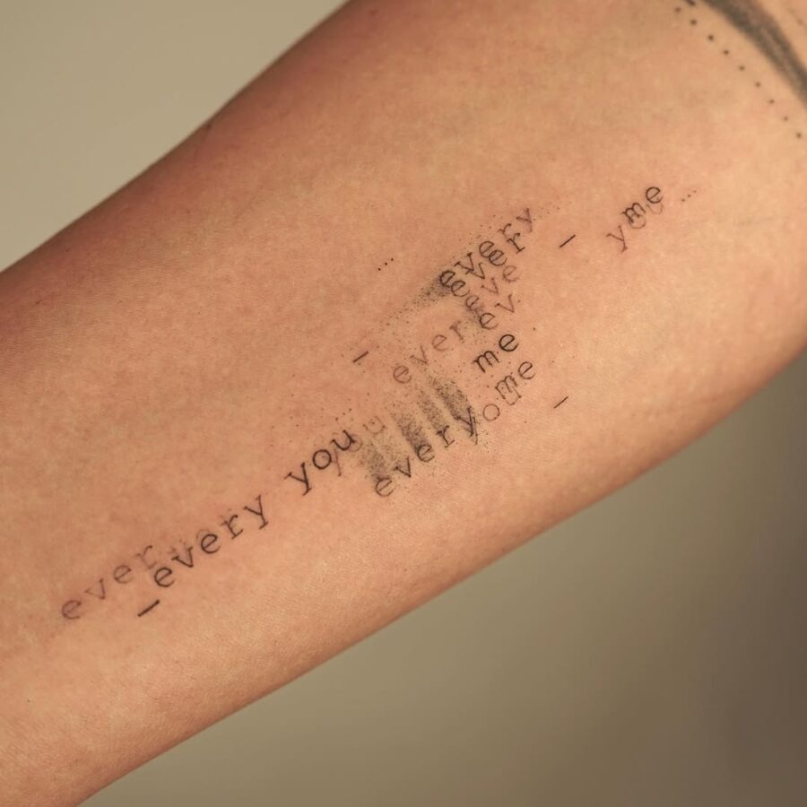 Artistic Tattoo Featuring Textual Overlap Tattoo Design