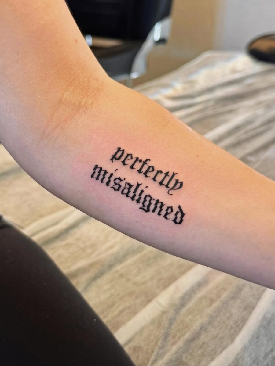 Bold script tattoo with unique flair Tattoo Design