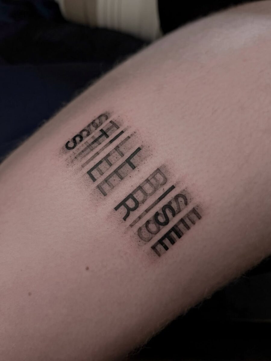 Bold text tattoo conveying resilience and strength Tattoo Design