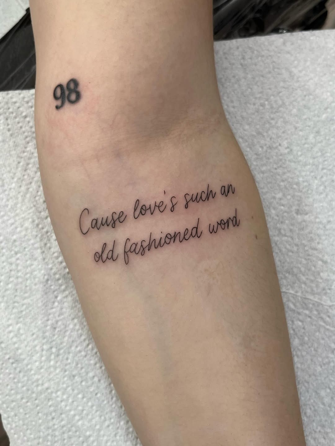 Elegant cursive tattoo with a heartfelt message Tattoo Design