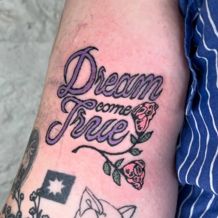 Elegant dream-themed tattoo with floral accents Tattoo Design