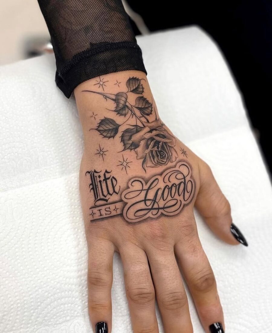 Elegant hand tattoo with rose and script Tattoo Design