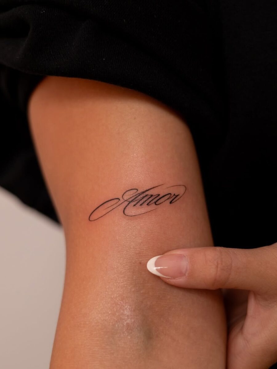 Elegant script tattoo embodies love and connection Tattoo Design