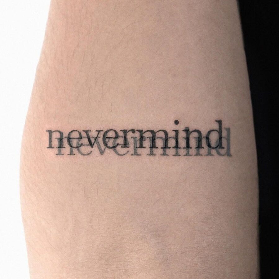 Minimalist tattoo with bold typography statement Tattoo Design