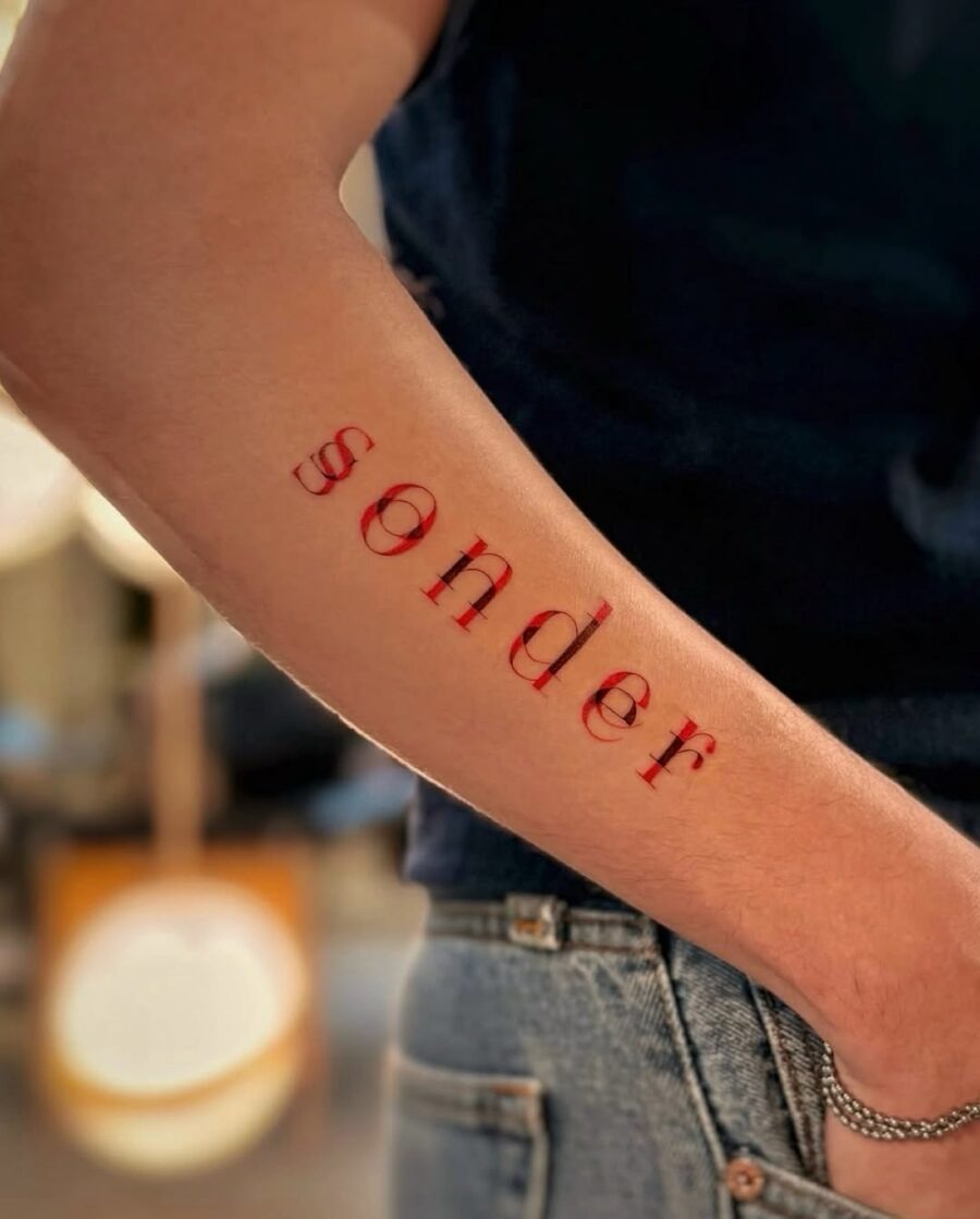 Stunning red font tattoo of 'sonder' Tattoo Design