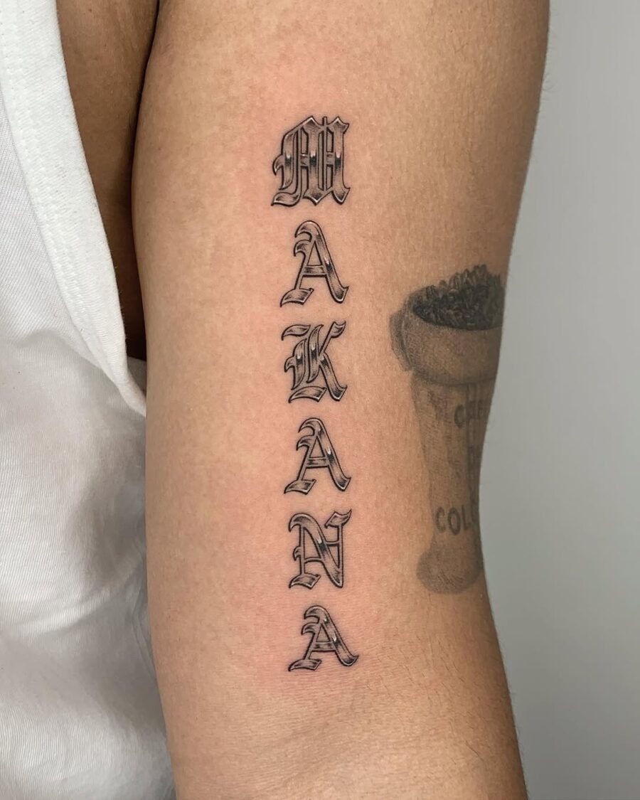 Stylish vertical tattoo featuring the word 'Makana' Tattoo Design