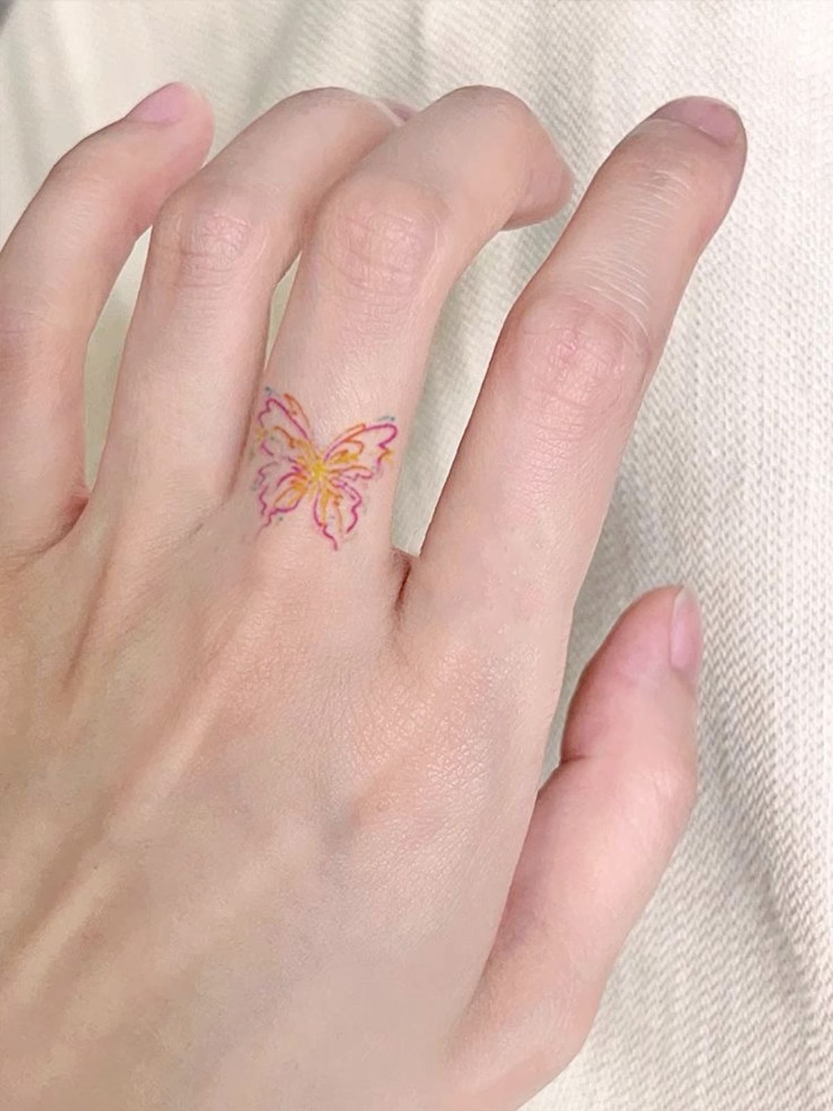 Delicate Colorful Butterfly Finger Tattoo Tattoo Design