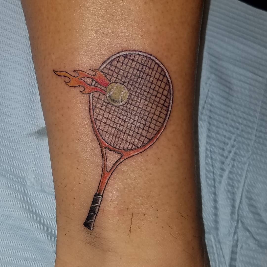 Artistic tennis racket tattoo with dynamic flames Tattoo Design