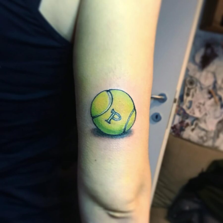Colorful tennis ball tattoo with letter P Tattoo Design