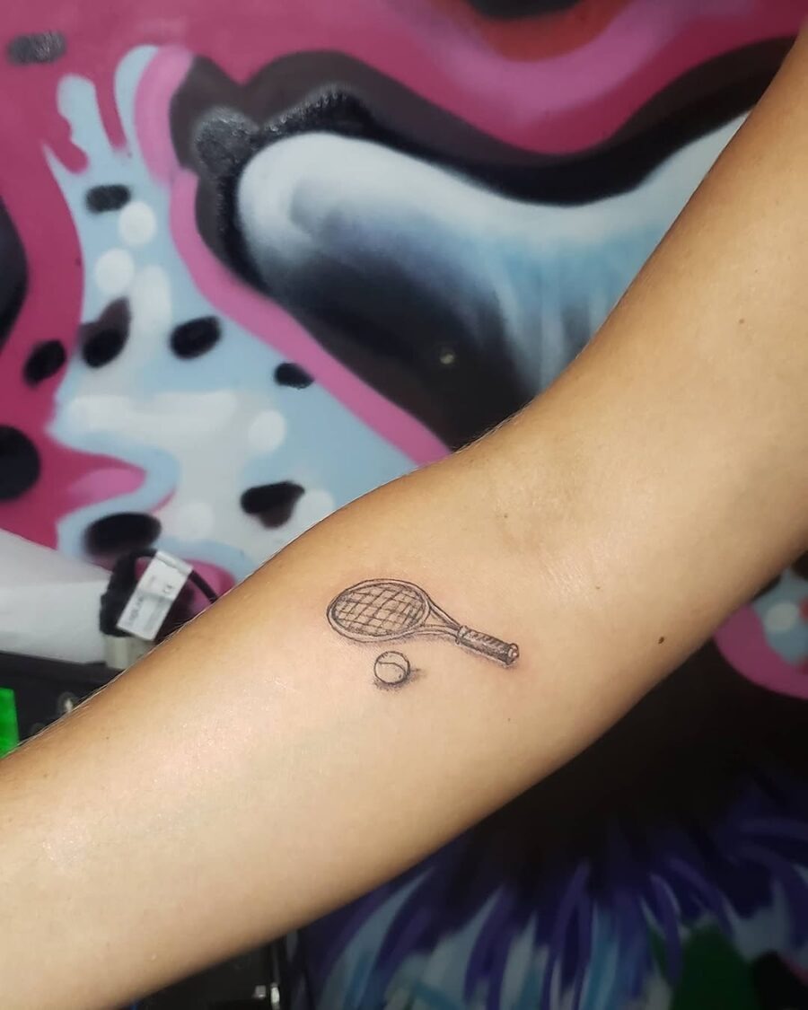 Stylish tennis racket and ball tattoo design Tattoo Design